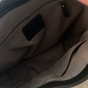 Pocketbook. Inside zip pocket and two open pockets